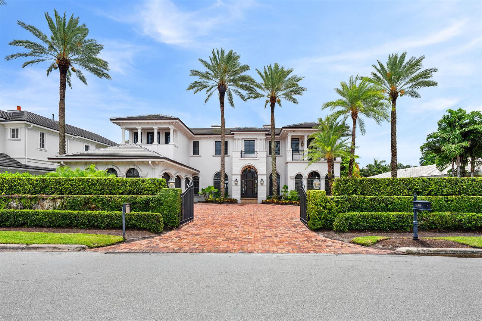 A large white two-story house with a brick driveway and tall palm trees — 450 S Maya Palm Drive, Boca Raton FL 33432, BOCA RATON, FL