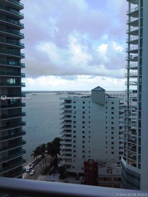 A view of a bay between two high-rise buildings with a mid-rise building in the center — 1300 Brickell Bay Dr # 1707, Miami FL 33131, MIAMI, FL