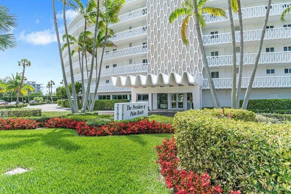 The exterior of a multi-story apartment building features a honeycomb facade and palm trees — 2505 S Ocean Boulevard # 303, Palm Beach FL 33480, PALM BEACH, FL