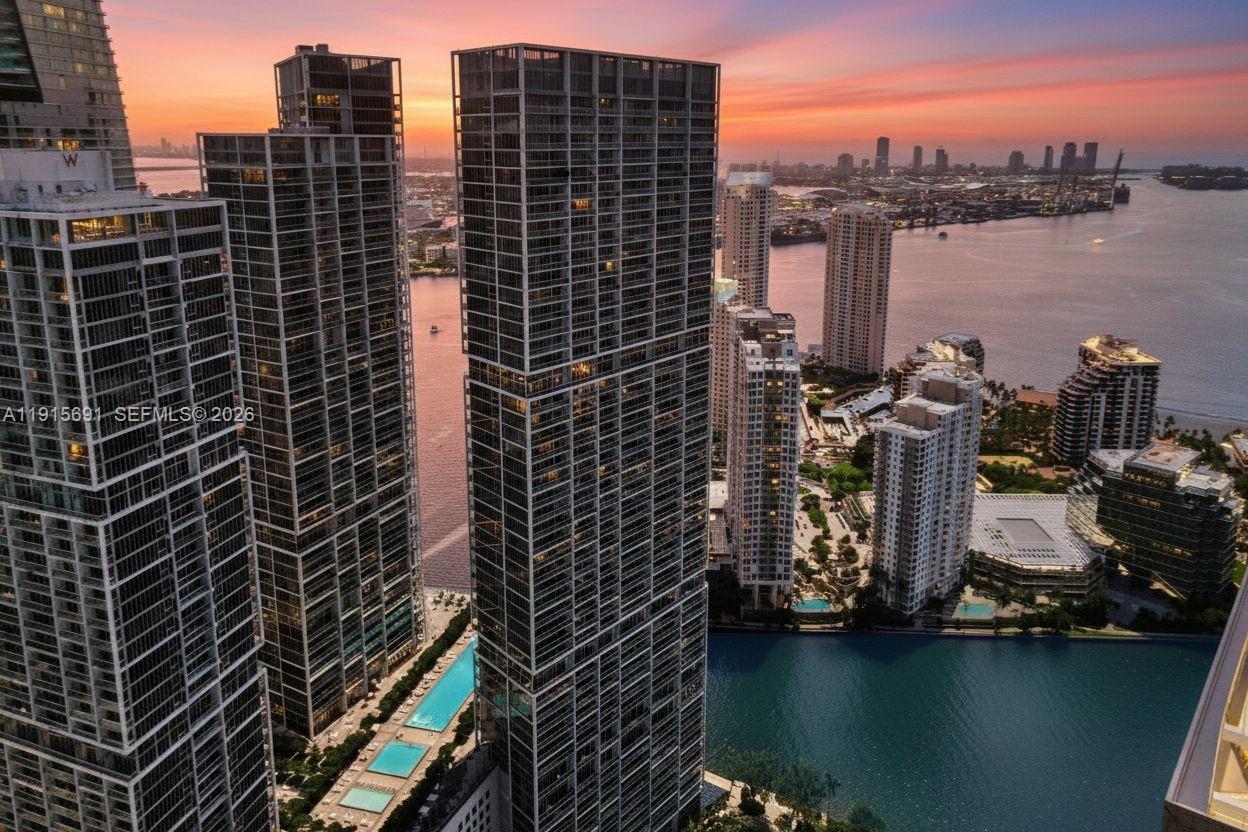 An aerial view of high-rise apartment buildings in Miami at sunset near the water — 495 Brickell Ave # 2206, Miami FL 33131, MIAMI, FL