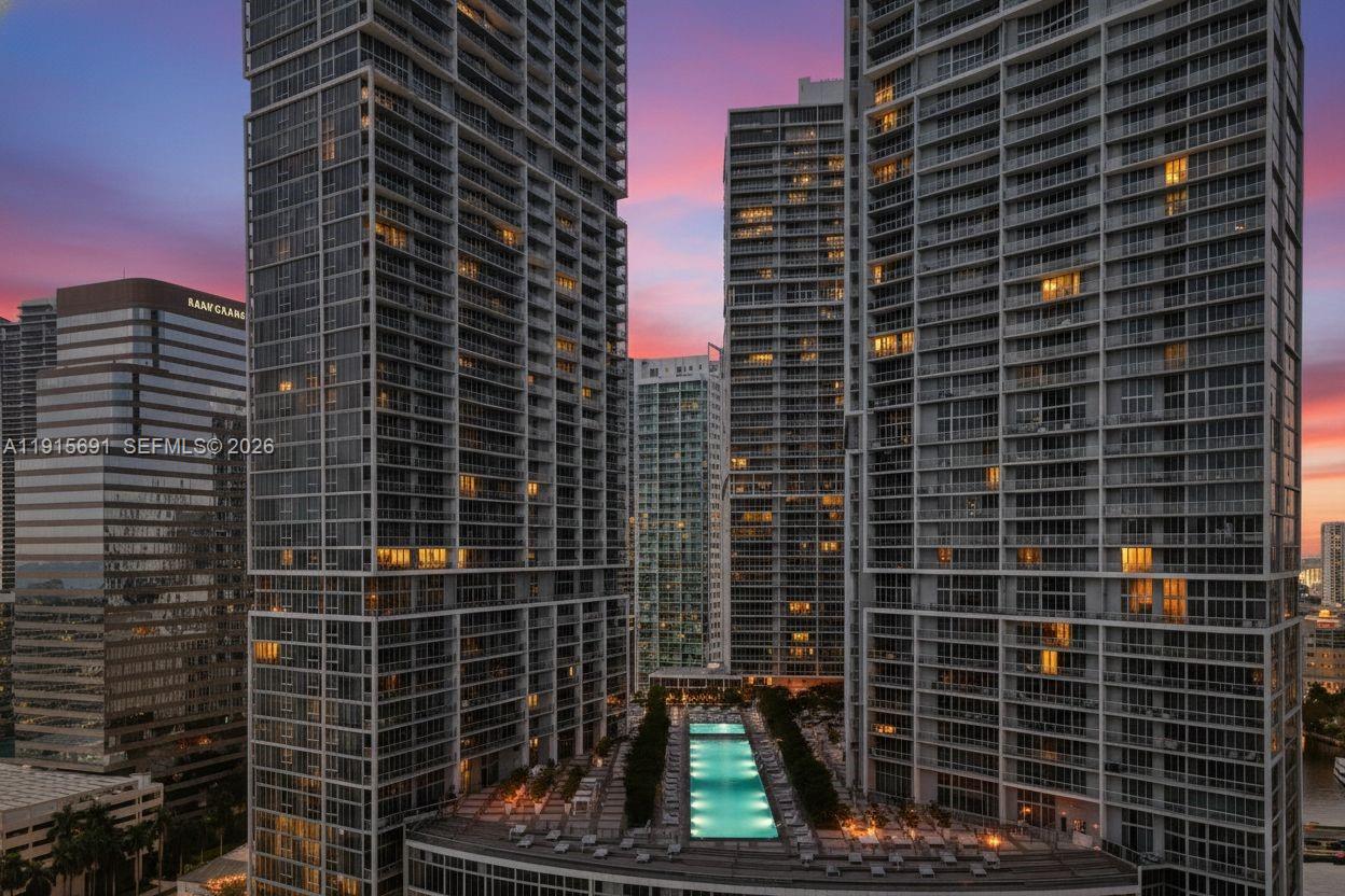 An aerial view shows a swimming pool on a terrace between two tall residential towers — 495 Brickell Ave # 2206, Miami FL 33131, MIAMI, FL