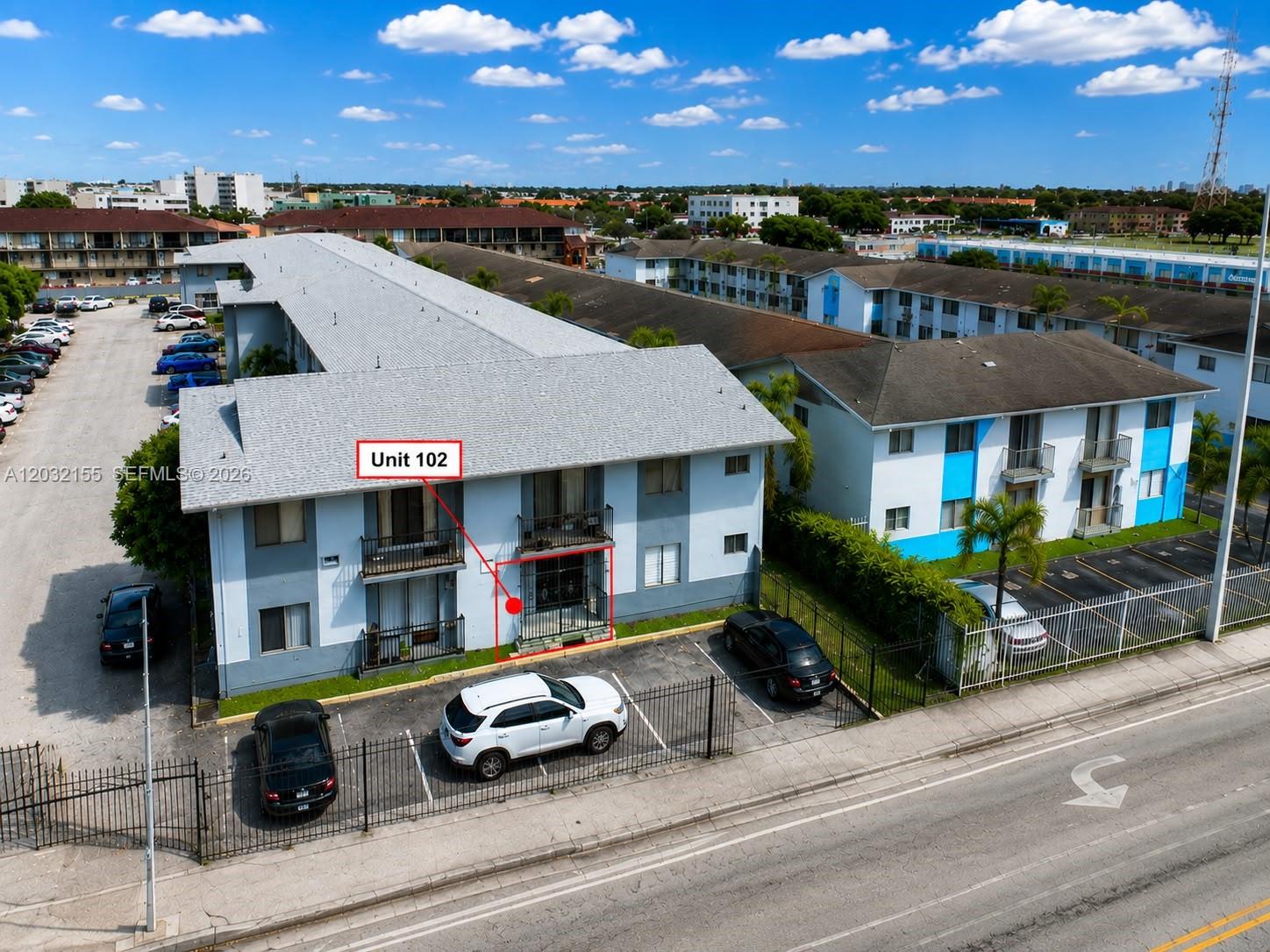 An aerial view shows a multi-story apartment building with a designated ground-floor unit — 6081 W 24th Ave # 102, Hialeah FL 33016, HIALEAH, FL