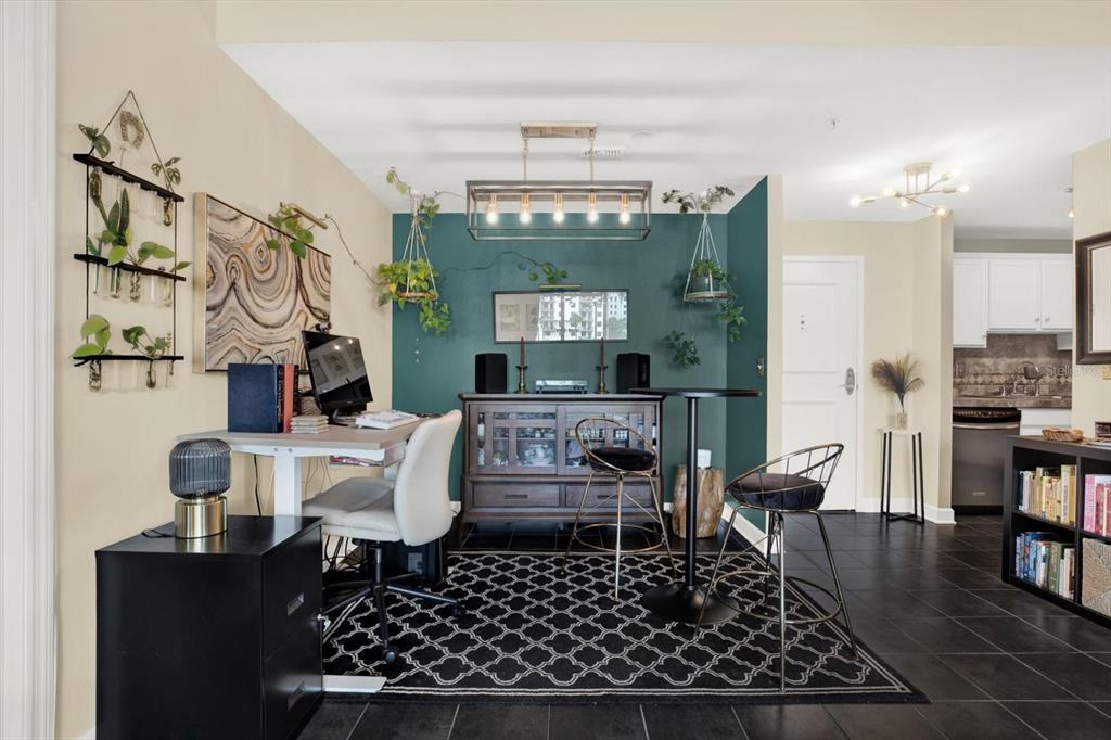 An empty room with black tile floors, white walls, and a balcony with exterior views — 345 BAYSHORE BOULEVARD UNIT 310, TAMPA, FL