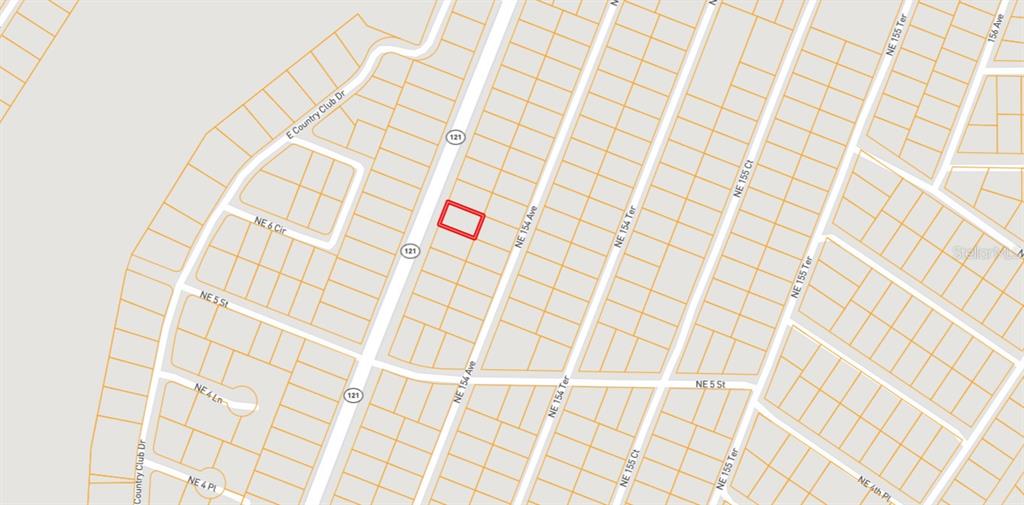 This is a map showing a highlighted rectangular property lot located along a road — TBD NE STATE ROAD 121, WILLISTON, FL