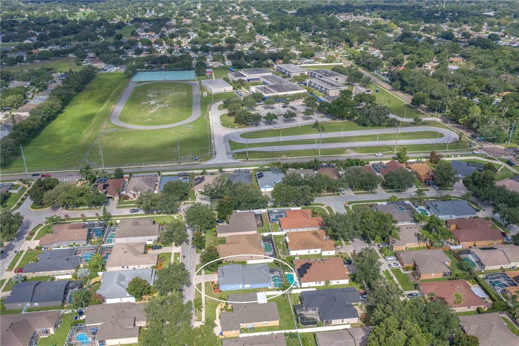 An aerial view shows a residential neighborhood with a highlighted house featuring a pool — 4306 ORANGE RIDGE COURT, VALRICO, FL