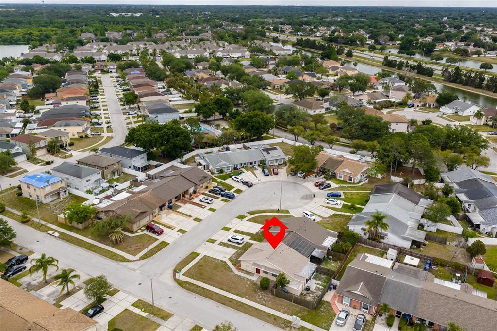 An aerial view shows a suburban neighborhood with a red marker on a single-family home — 1720 OAK BRANCH COURT, BRANDON, FL
