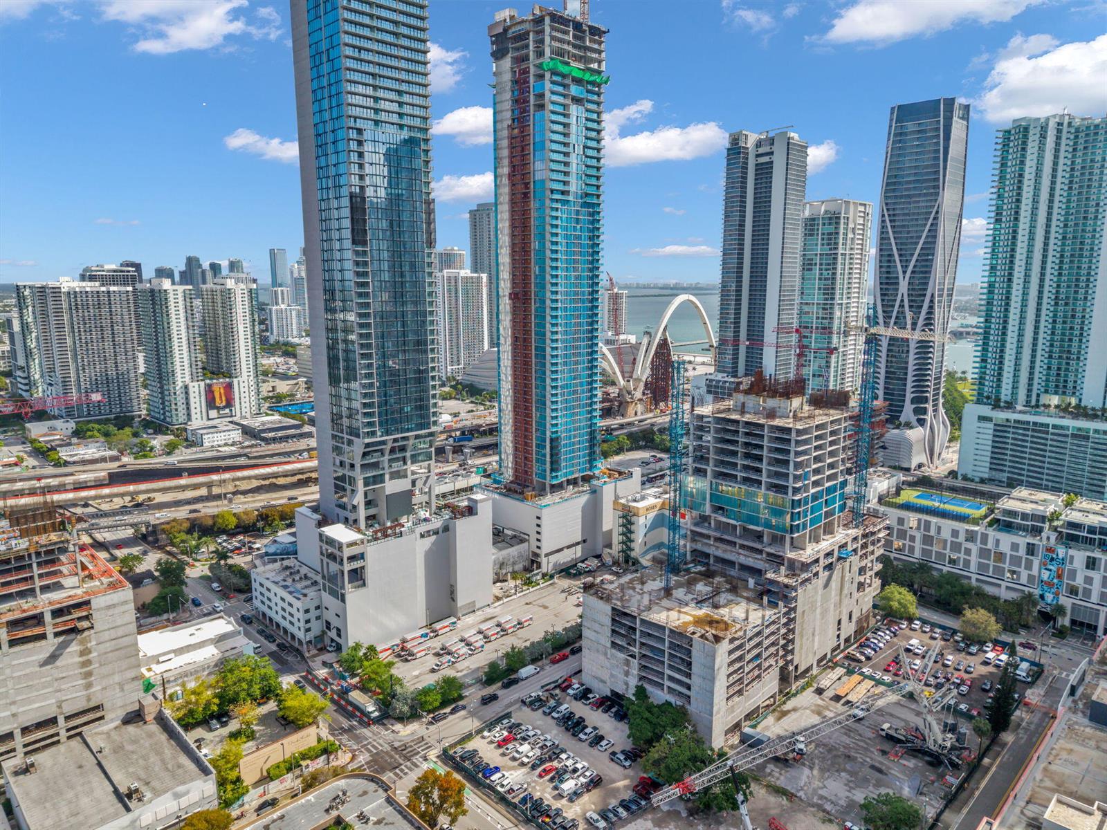 An aerial view of a city skyline featuring several high-rise buildings under construction — 20 NE 11th Street # 3205, Miami FL 33132, MIAMI, FL