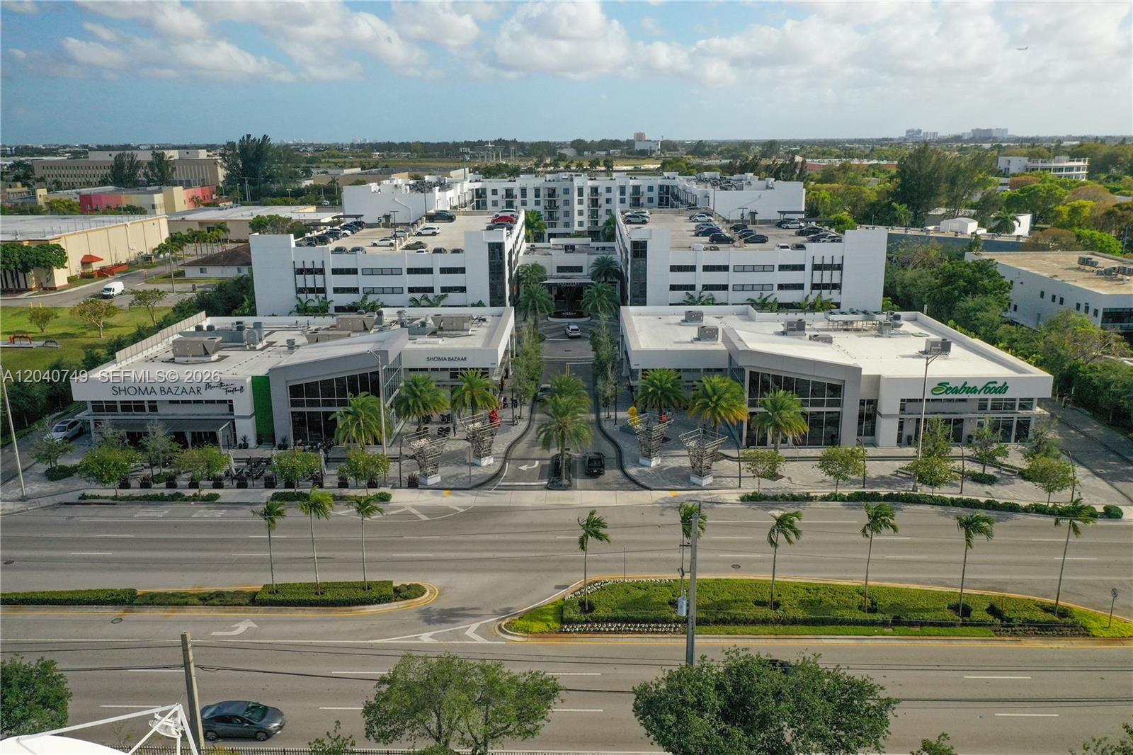 An aerial view of a modern commercial complex featuring Shoma Bazaar and Seabra Foods — 9420 NW 41st St # 2, Doral FL 33178, DORAL, FL
