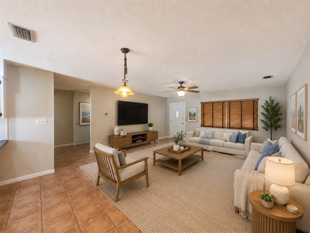 A backyard features a swimming pool, a detached garage, a truck, and palm trees — 11298 73RD AVENUE N, SEMINOLE, FL