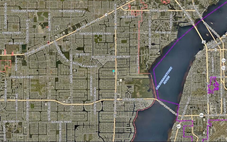 This is a map showing the street layout and waterways of Cape Coral, Florida — 1459 SE 14TH STREET, CAPE CORAL, FL
