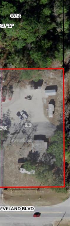 This is an aerial map view of a rectangular lot containing a building and driveway — 7127 W GROVER CLEVELAND BOULEVARD UNIT 48, HOMOSASSA, FL