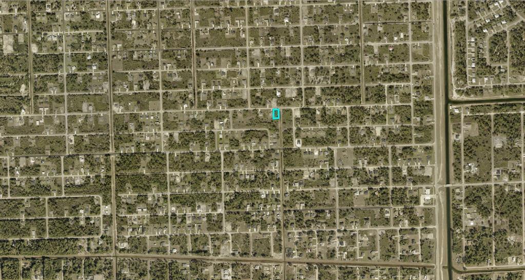 An aerial map view shows a rectangular plot of land highlighted in blue — 2709 53RD STREET W, LEHIGH ACRES, FL