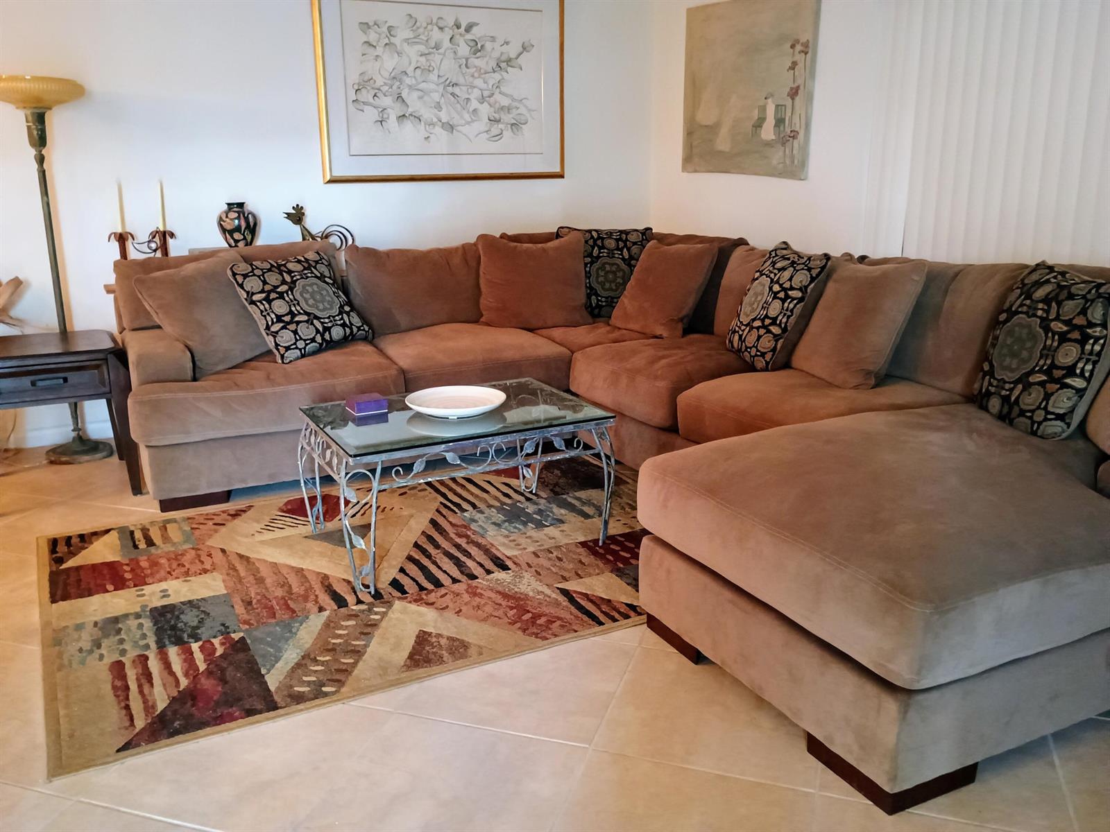 A living room features a large brown sectional sofa, a glass-topped coffee table, and area rug — 14716 Canalview Drive # D, Delray Beach FL 33484, DELRAY BEACH, FL
