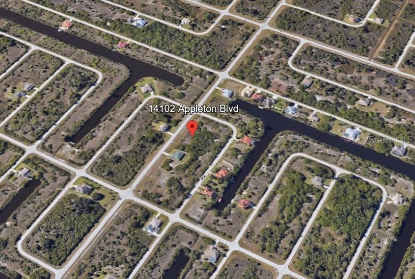 This aerial map shows a vacant residential lot located along a canal in a neighborhood — 14102 APPLETON BOULEVARD, PORT CHARLOTTE, FL