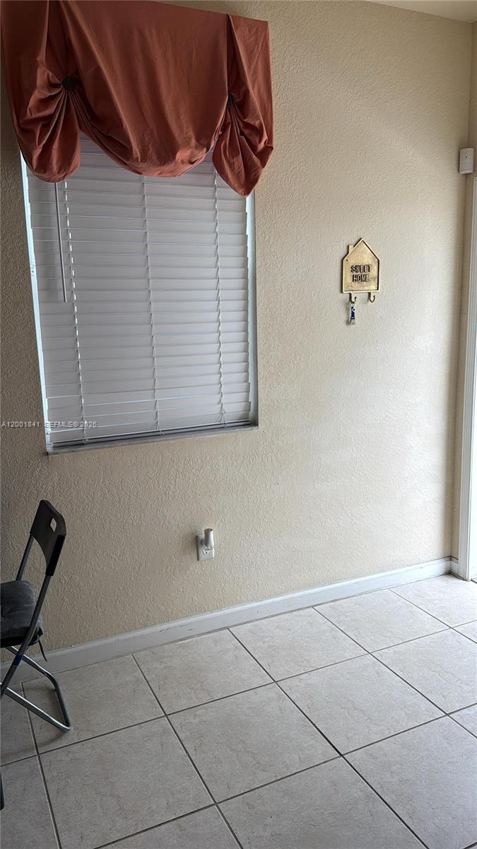 A room with tiled floors, a window with blinds and a valance, and a key holder — 16961 SW 90th Ter, Miami FL 33196, MIAMI, FL