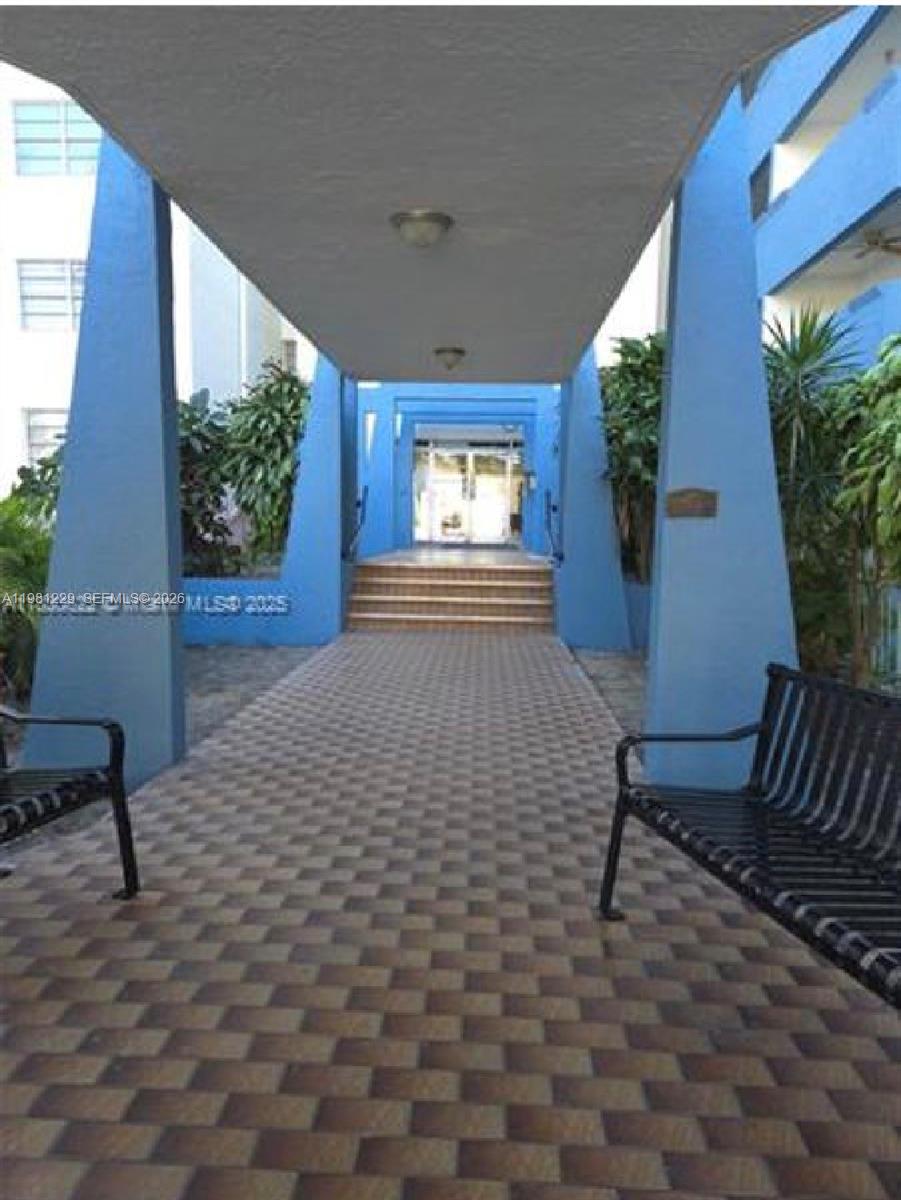 A compact kitchen features white shaker cabinets, stainless steel appliances, and light-colored countertops — 5050 NW 7th St # 511, Miami FL 33126, MIAMI, FL