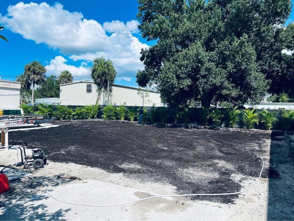 A large, cleared dirt lot features a white hose and a small piece of equipment — 1254 PINEY ROAD, NORTH FORT MYERS, FL