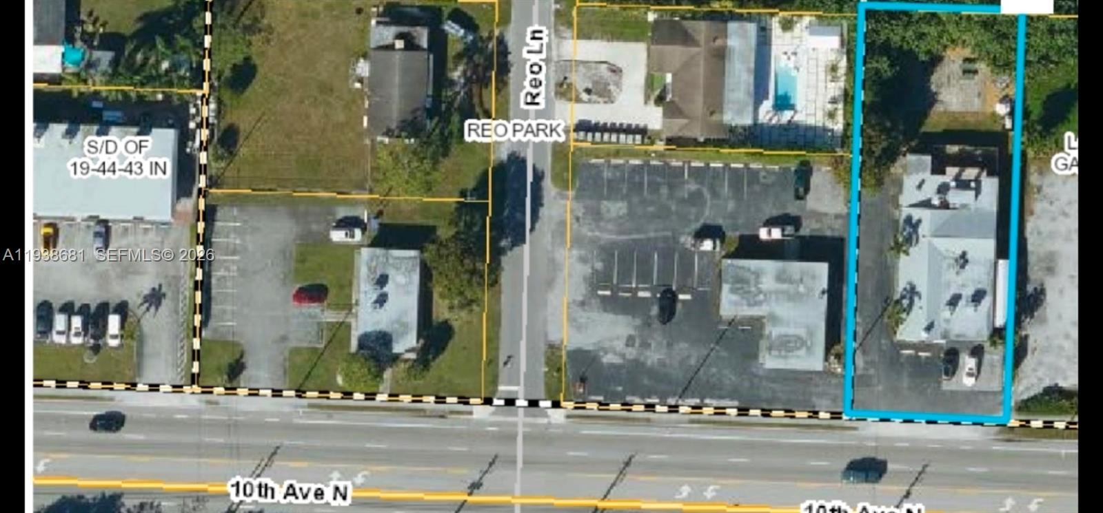 This aerial map shows a commercial property outlined in blue along a main road — 3801 N 10th Ave N, Palm Springs FL 33461, PALM SPRINGS, FL