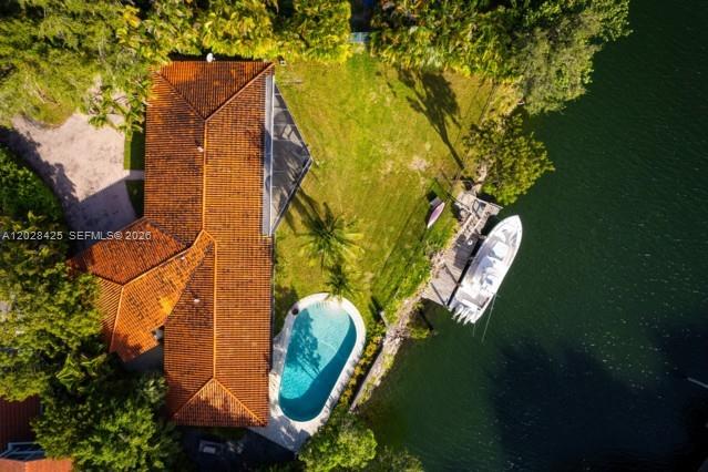 An aerial view shows a house with a tiled roof, a pool, and a docked boat — 230 Edgewater Dr, Coral Gables FL 33133, CORAL GABLES, FL