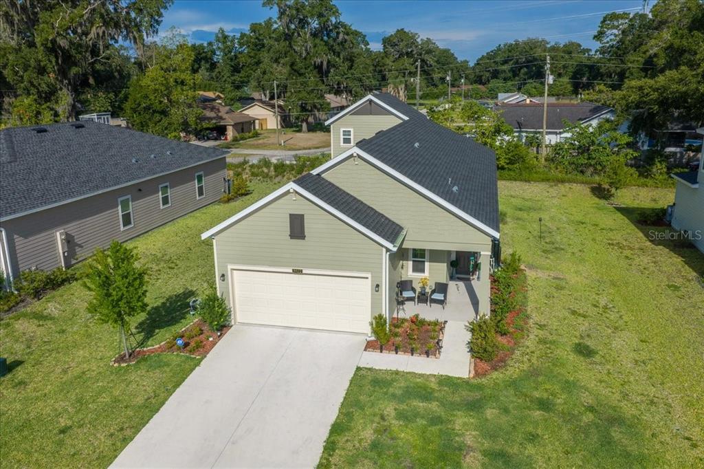 An aerial view of a light green suburban house with a two-car garage — 3902 NE 30TH TERRACE, OCALA, FL
