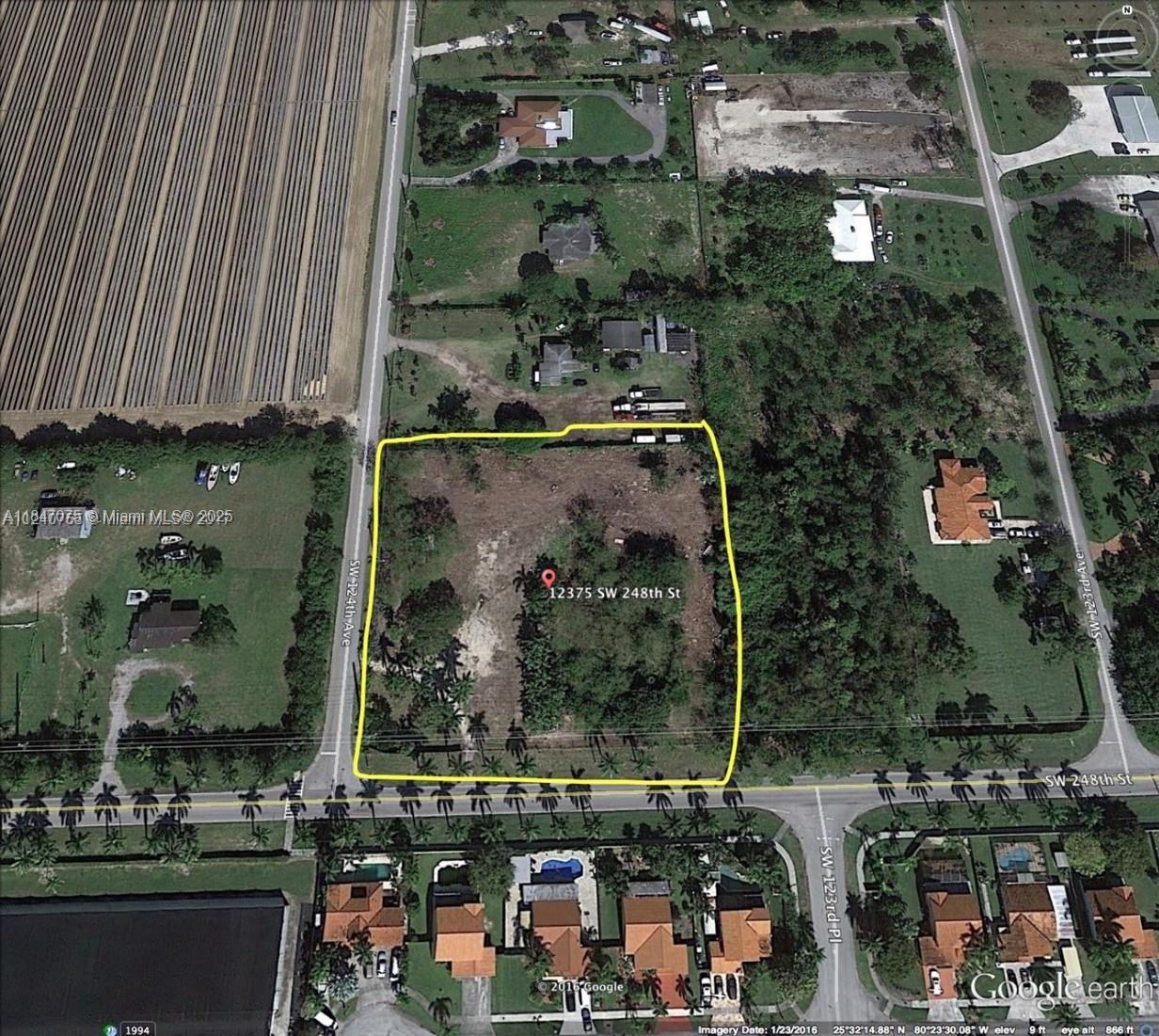 An aerial view shows a rectangular vacant lot outlined in yellow near a road intersection — 12375 SW 248th St, Homestead FL 33032, HOMESTEAD, FL