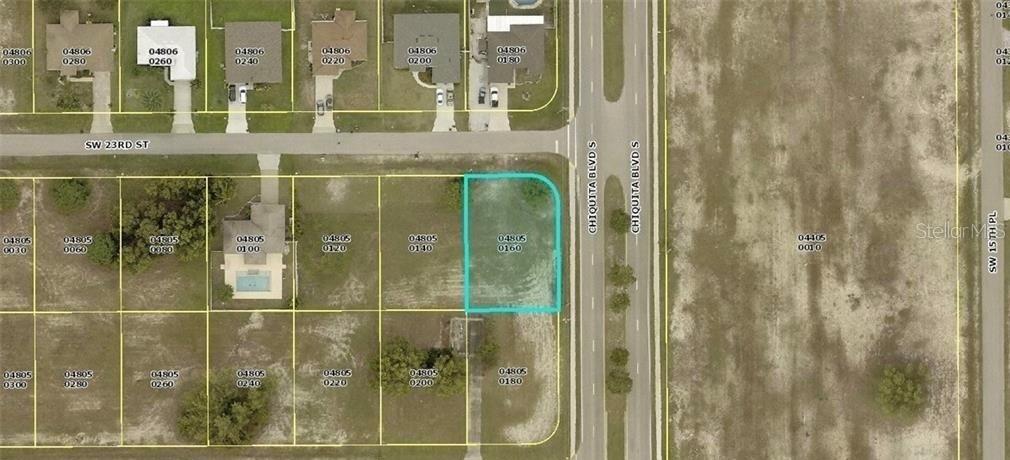 This is an aerial map showing a vacant corner lot highlighted in blue — 1602 SW 23RD STREET, CAPE CORAL, FL