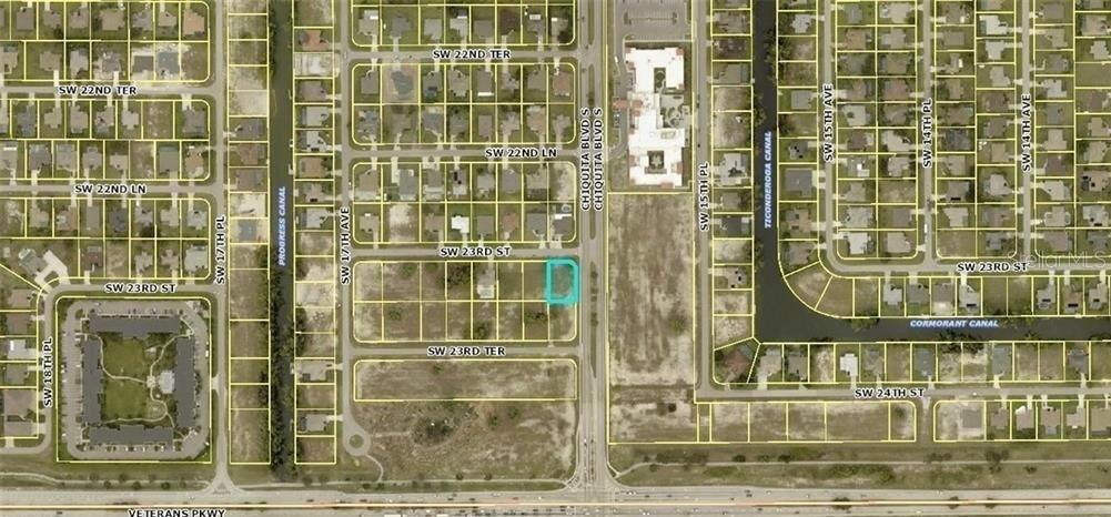 This is an aerial map showing a highlighted vacant residential lot in a suburban neighborhood — 1602 SW 23RD STREET, CAPE CORAL, FL