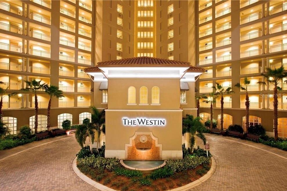 The exterior of The Westin hotel features a central fountain and a paved circular driveway — 1602 SW 23RD STREET, CAPE CORAL, FL