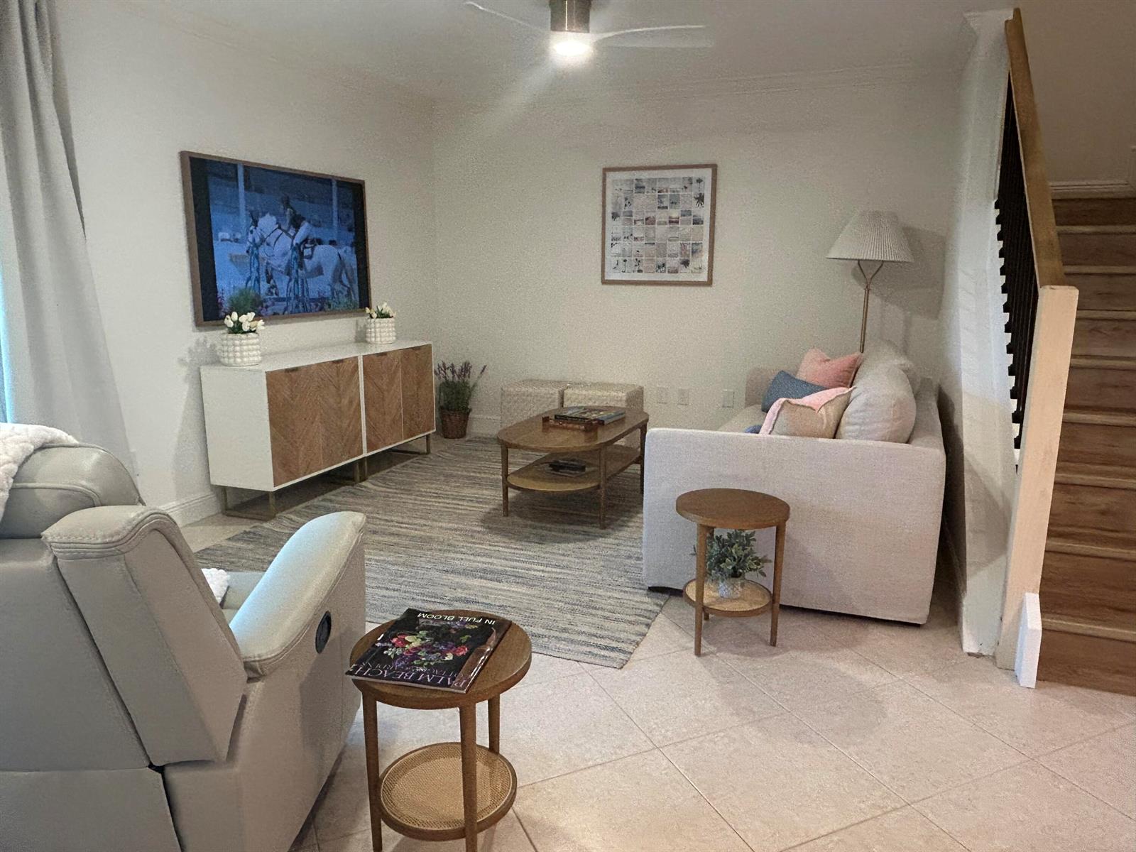 A living room features a sofa, a recliner, a wooden coffee table, and a media console — 12768 Westhampton Circle, Wellington FL 33414, WELLINGTON, FL