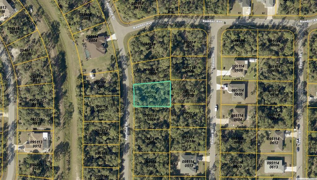 This is an aerial map showing a highlighted vacant residential lot in a suburban neighborhood — RAYFIELD DR, NORTH PORT, FL