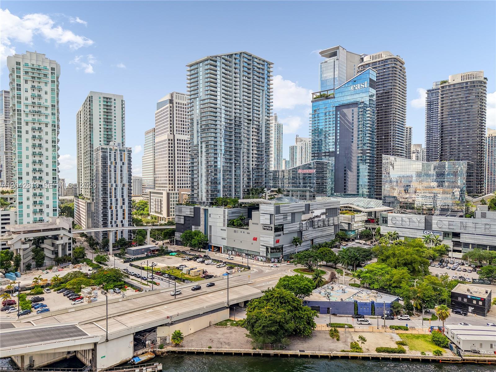 An elevated view of the Miami skyline featuring high-rise buildings, a shopping center, and a bridge — 90 SW 3rd St # 3003, Miami FL 33130, MIAMI, FL