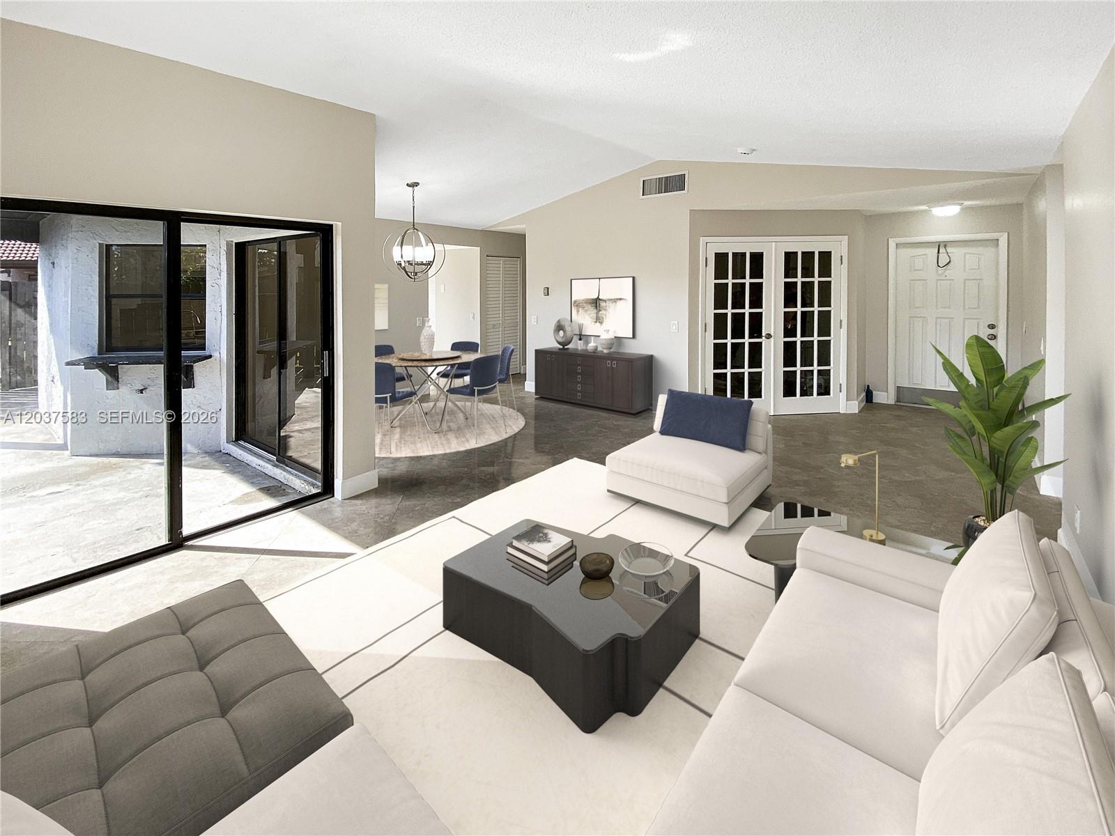 A living room and dining area feature tile floors, white walls, and sliding glass doors — 14980 SW 48th Ter # 28F, Miami FL 33185, MIAMI, FL