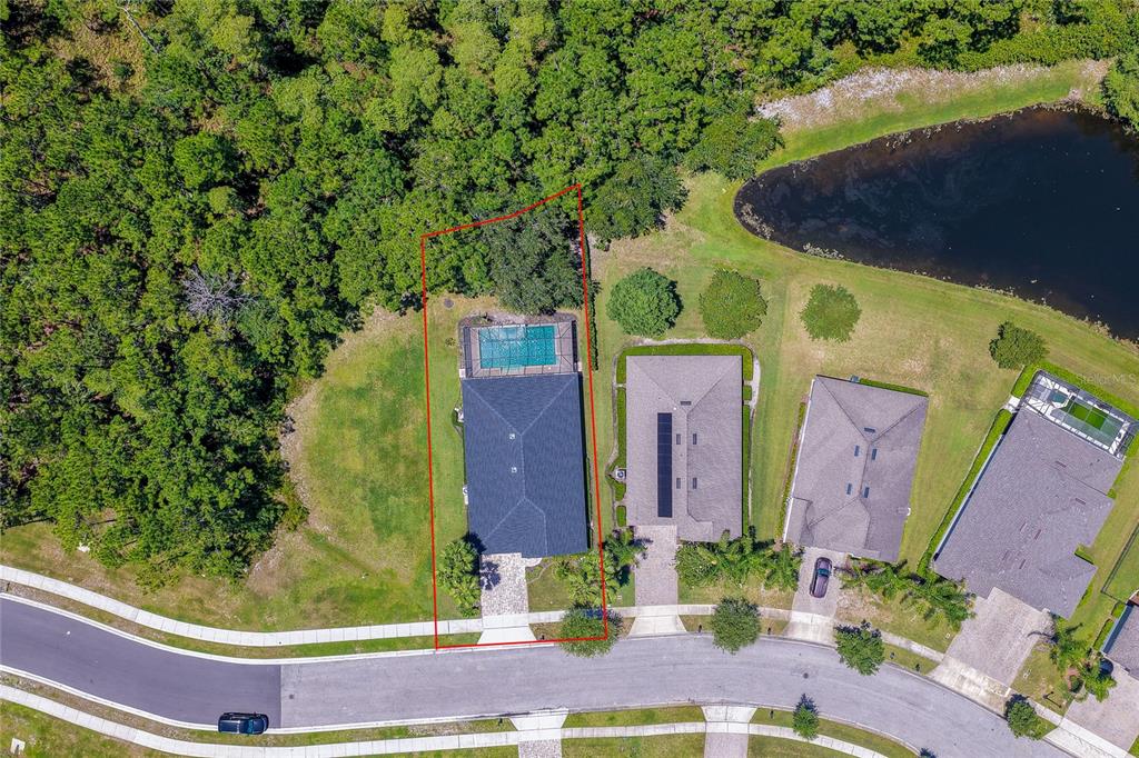 Aerial view of a single-family home with a pool and screened lanai in a neighborhood — 312 BIRKDALE DRIVE, DAYTONA BEACH, FL