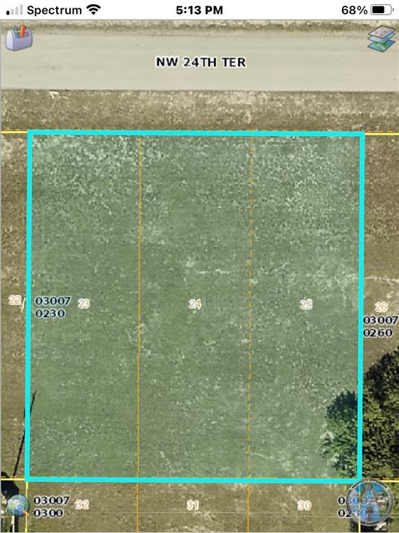This is a map showing three adjacent vacant lots outlined in blue along a road — 1406 NW 24TH TERRACE, CAPE CORAL, FL