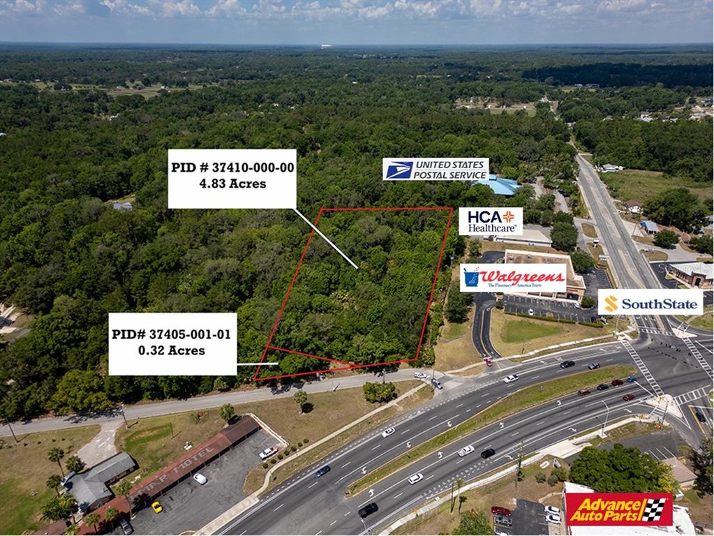 An aerial view shows two wooded land parcels outlined in red near a commercial intersection — 11090 SE 55TH AVENUE ROAD, BELLEVIEW, FL