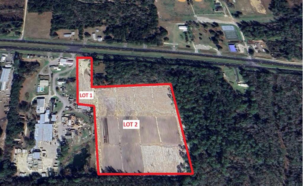 An aerial view shows two adjacent rectangular lots of land outlined in red — 20065 SE HAWTHORNE ROAD, HAWTHORNE, FL