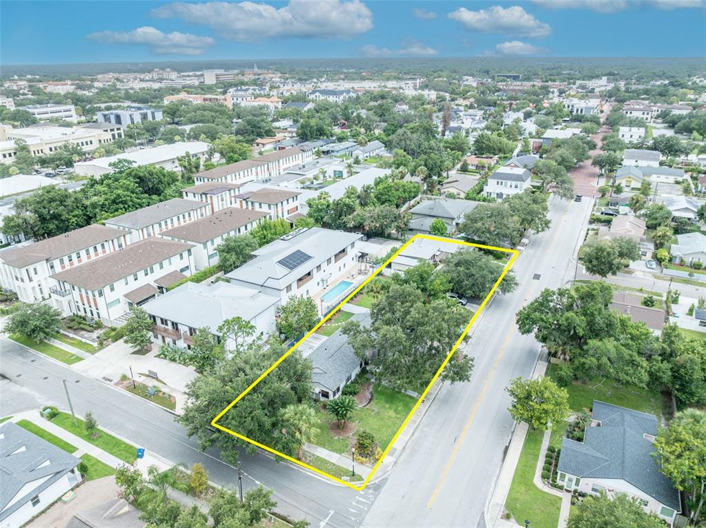 An aerial view shows a residential lot outlined in yellow with trees and a house — 540 N PENNSYLVANIA AVENUE, WINTER PARK, FL