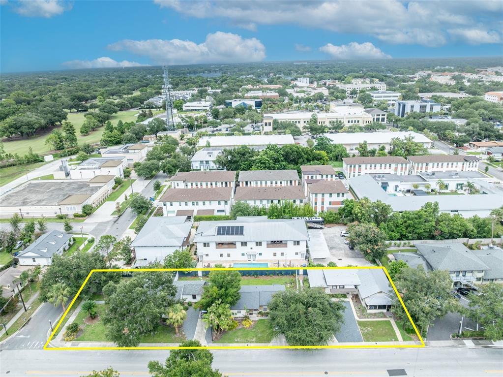 An aerial view shows a single-story house with a large yard outlined in yellow — 540 N PENNSYLVANIA AVENUE, WINTER PARK, FL