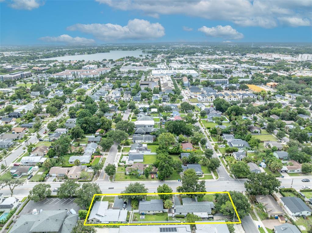 An aerial view shows a residential property outlined in yellow within a suburban neighborhood — 540 N PENNSYLVANIA AVENUE, WINTER PARK, FL