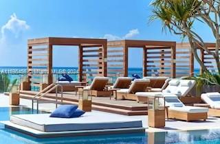 This is a rendering of a luxury outdoor pool deck with cabanas and lounge chairs — 102 24th St # 1421, Miami Beach FL 33139, MIAMI BEACH, FL