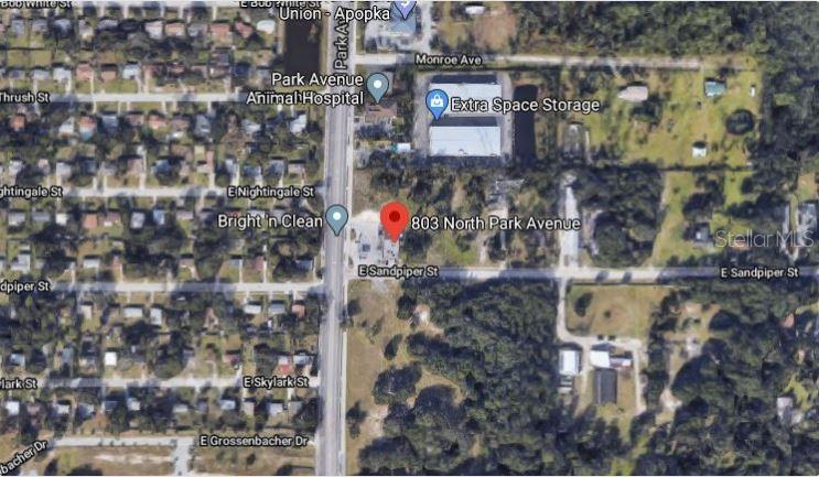 This is an aerial map view showing a commercial property location along a main road — 803 N PARK AVENUE, APOPKA, FL