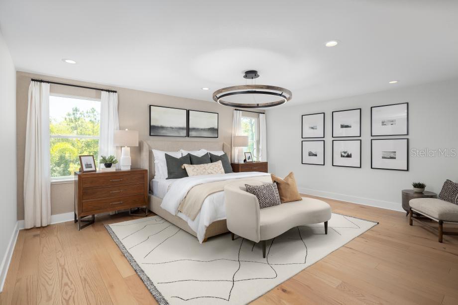 A bedroom features a king bed, a curved bench, a chandelier, and light wood flooring — 8031 TIMBERWOOD LANE, ORLANDO, FL