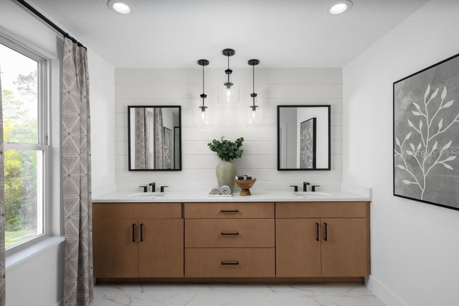 A bathroom features a double vanity with wood cabinets, shiplap wall, and three pendant lights — 8031 TIMBERWOOD LANE, ORLANDO, FL