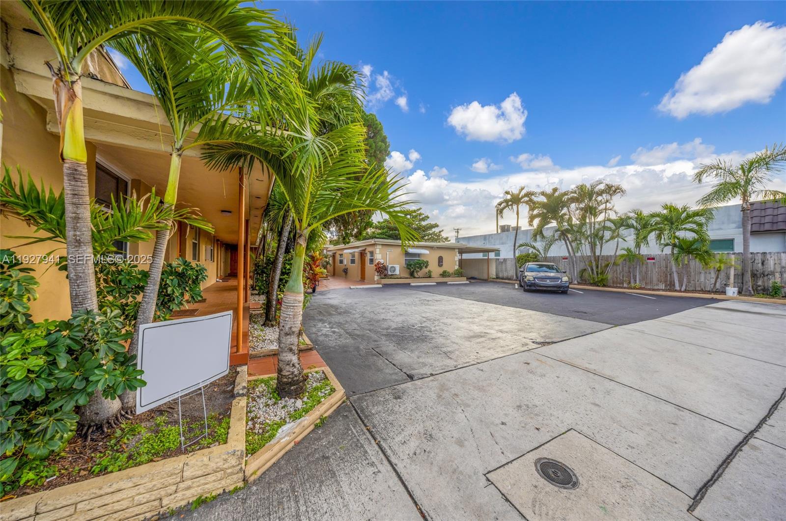 An exterior view shows a parking lot in front of a single-story building with palms — 6124 Pembroke Rd # 8, Miramar FL 33023, MIRAMAR, FL