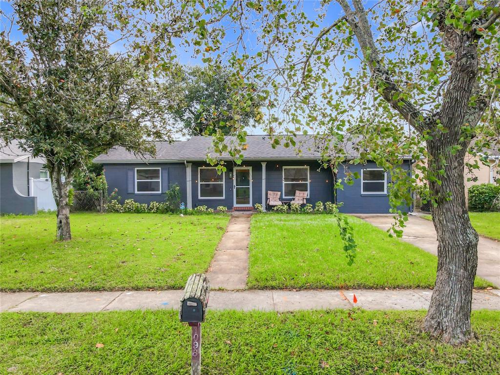 A single-story house with dark gray siding, a front walkway, and a mailbox in the yard — 1098 HENRY BALCH DRIVE, ORLANDO, FL