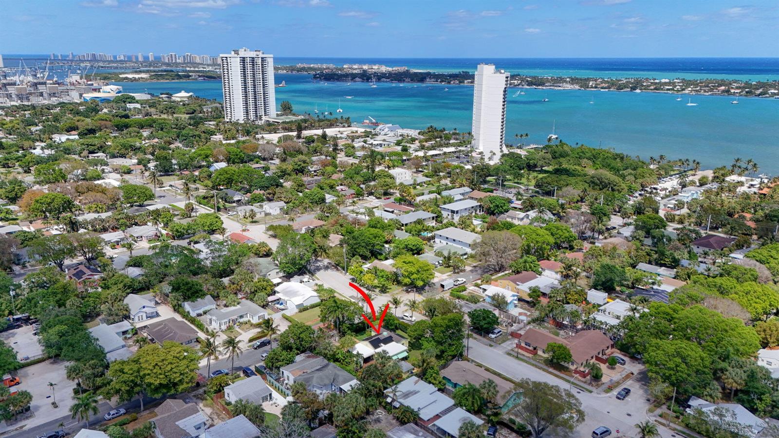 An aerial view shows a residential neighborhood with a red arrow pointing to a house — 502 49th Street, West Palm Beach FL 33407, WEST PALM BEACH, FL