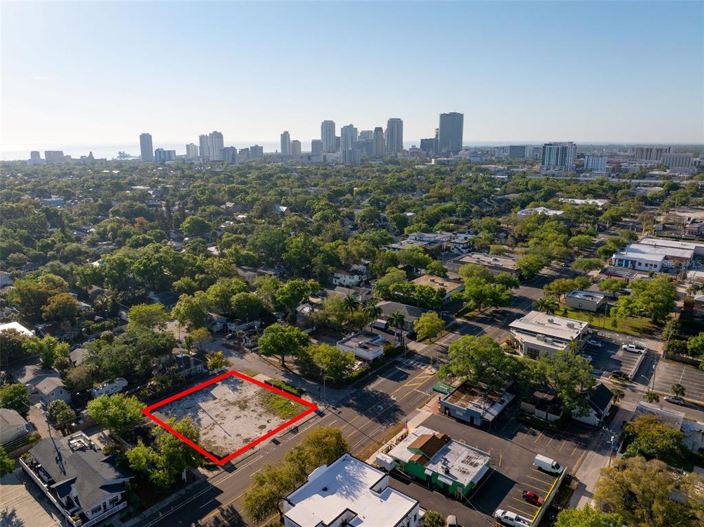 An aerial view shows a vacant rectangular lot outlined in red within a city neighborhood — 1201 DR MARTIN LUTHER KING JR STREET N, ST PETERSBURG, FL