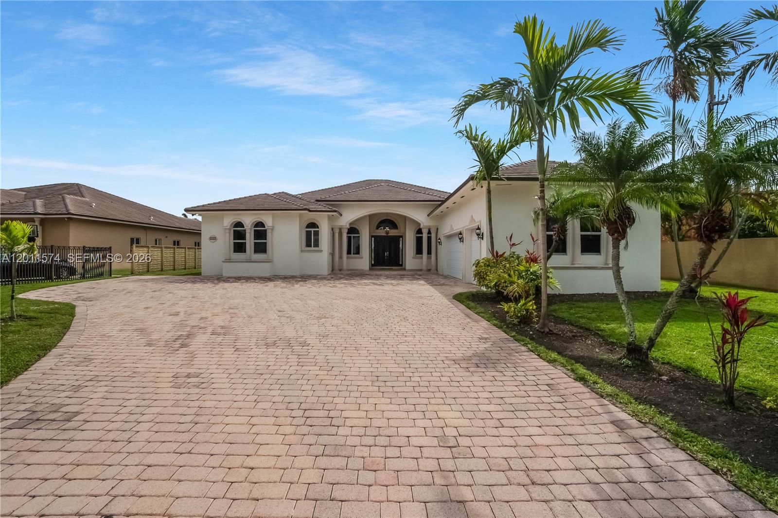 A single-story house with a paved driveway, palm trees, and a tiled roof — 4025 SW 128th Ave, Miami FL 33175, MIAMI, FL