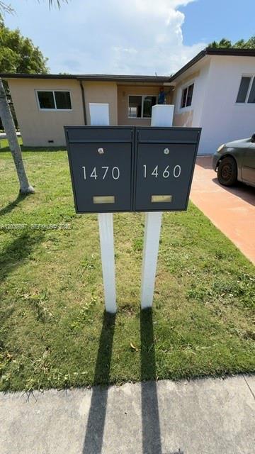 Two modern gray mailboxes stand on white posts in front of a single-story house — 1460 SW 65th Ave, West Miami FL 33144, WEST MIAMI, FL