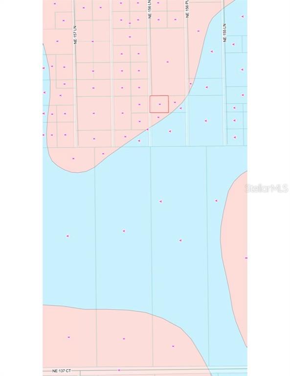 This is a property map showing a highlighted parcel of land within a residential area — TBD NE 156 LANE, FORT MC COY, FL